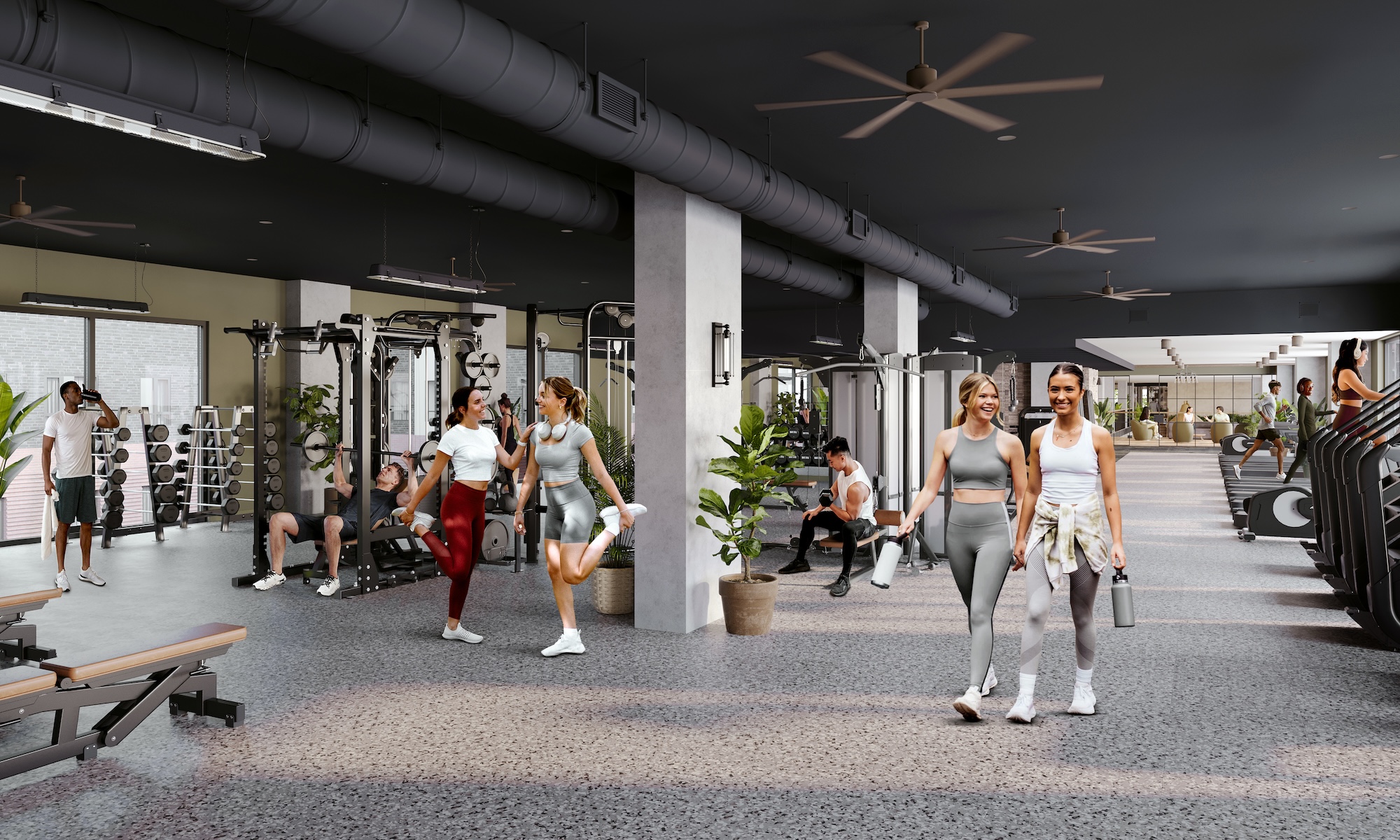Texas A&M students exercising in the fitness studio of The Jay, a student apartment near Texas A&M campus.