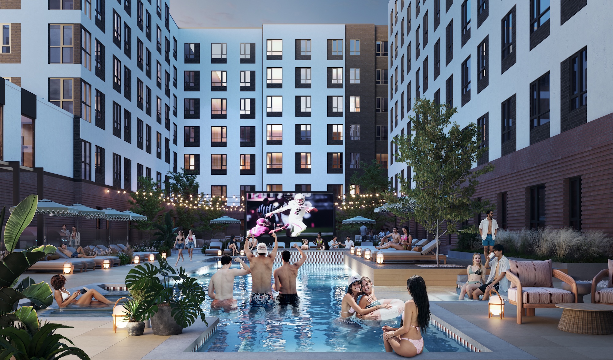 Texas A&M students in the pool watching the football game on the jumbotron at The Jay